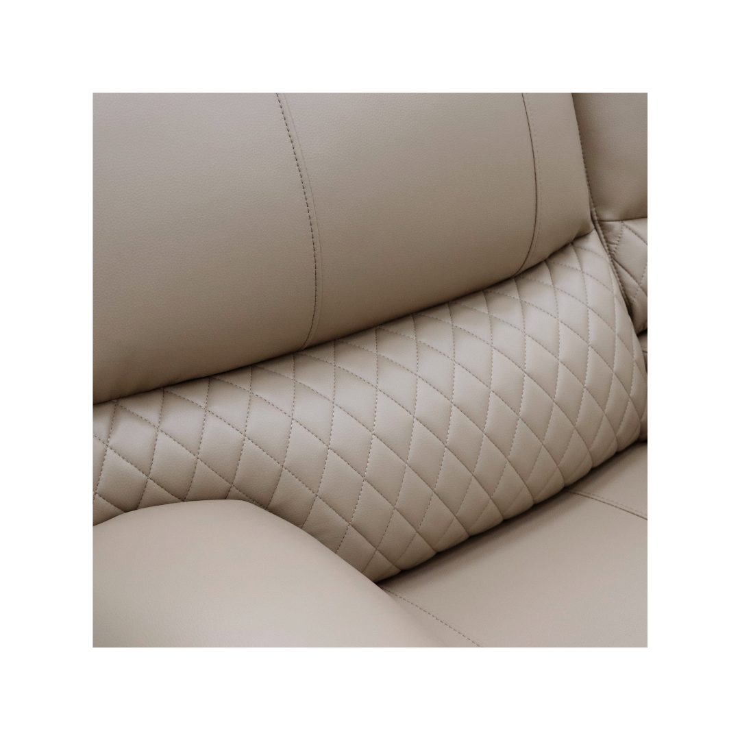 Close-up of the elegant diamond quilting detail on the backrest of the Alta sofa.