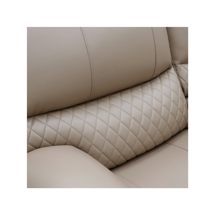 Close-up of the elegant diamond quilting detail on the backrest of the Alta sofa.