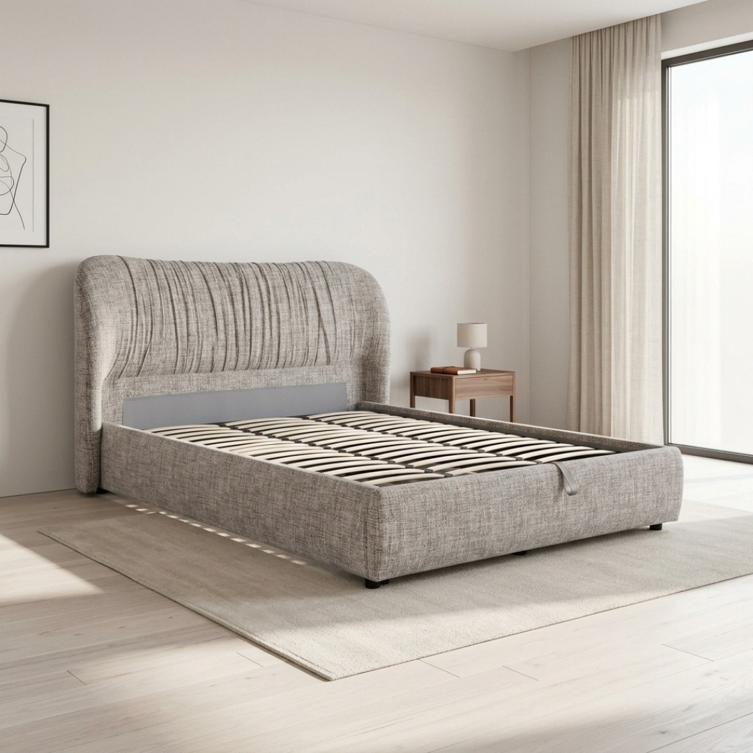 Astrid Queen Gaslift Storage Bed in light grey textured fabric, shown with the tall curved sleigh-style headboard and vertical channel stitching in a bedroom setting