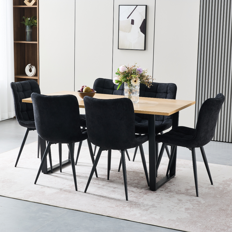 Elden dining chair featuring thick high-density padding and curved backrest support with slim black metal legs.