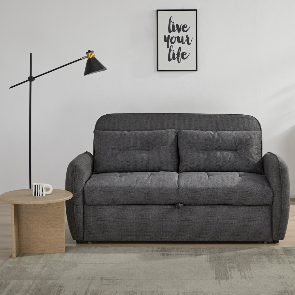 Enzo Sofa Bed Grey showing compact 2-seater grey fabric sofa styled in a modern living room at NZ Furniture Warehouse