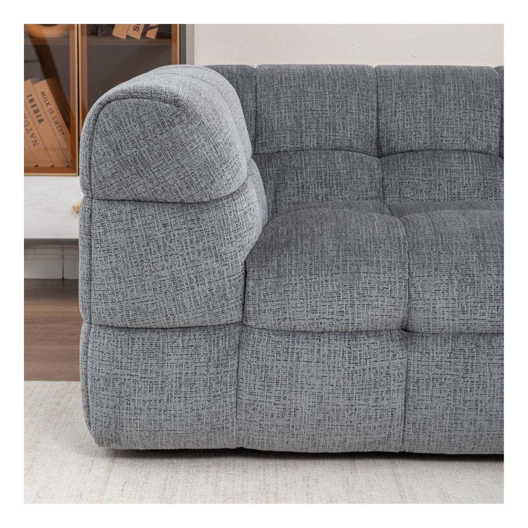 Close-up of premium grey biscuit-tufted fabric on the Finn 3 seater couch, highlighting durable material and stitching.