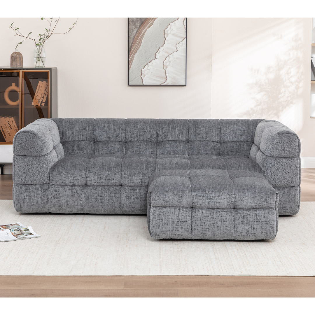 Front view of Finn grey fabric sofa showing modular ottoman placement in a bright, minimalistic modern living room.