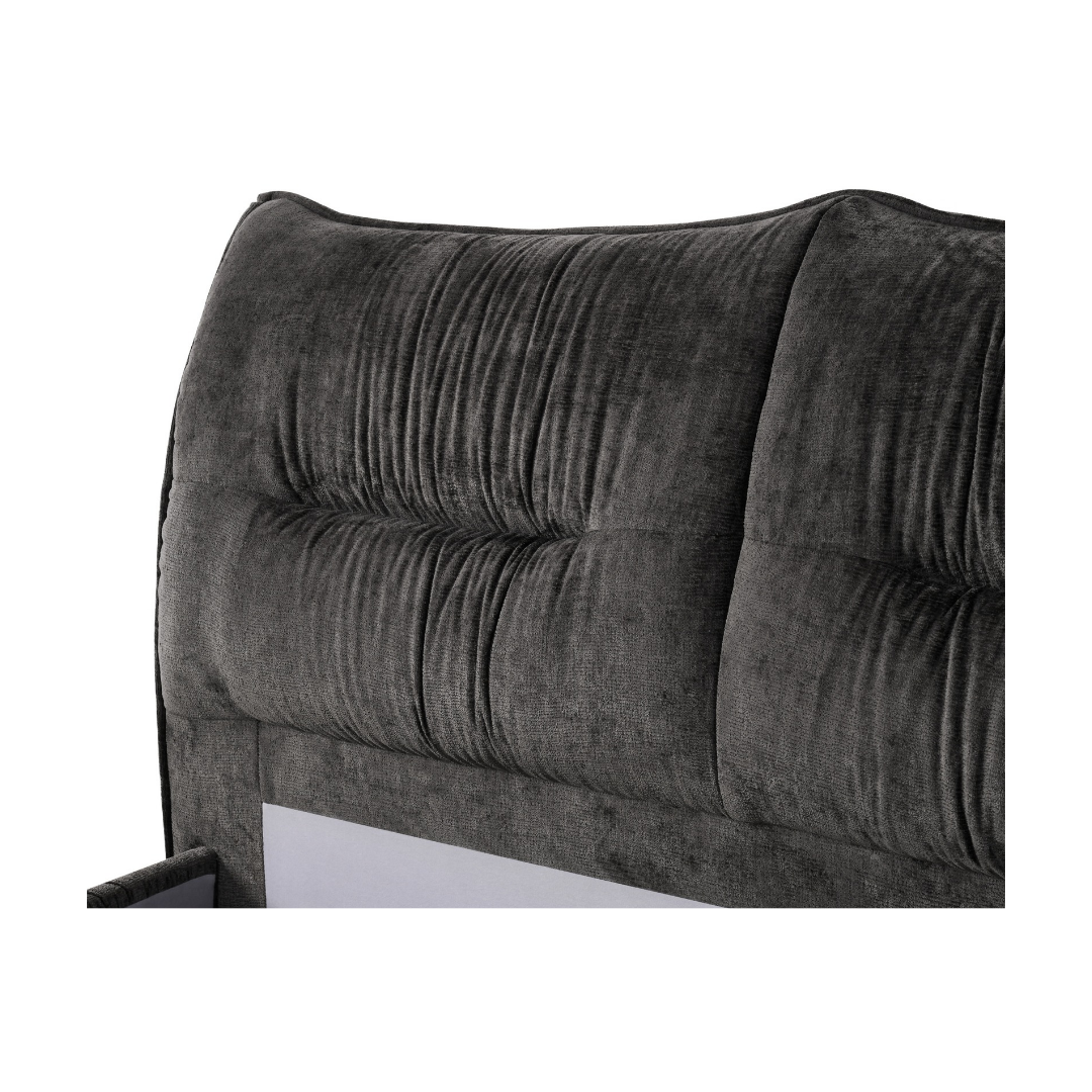 Close-up of the Kari Queen Gaslift Storage Bed's headboard showing the wave-edged top, horizontal tufted button channel, and black textured fabric weave