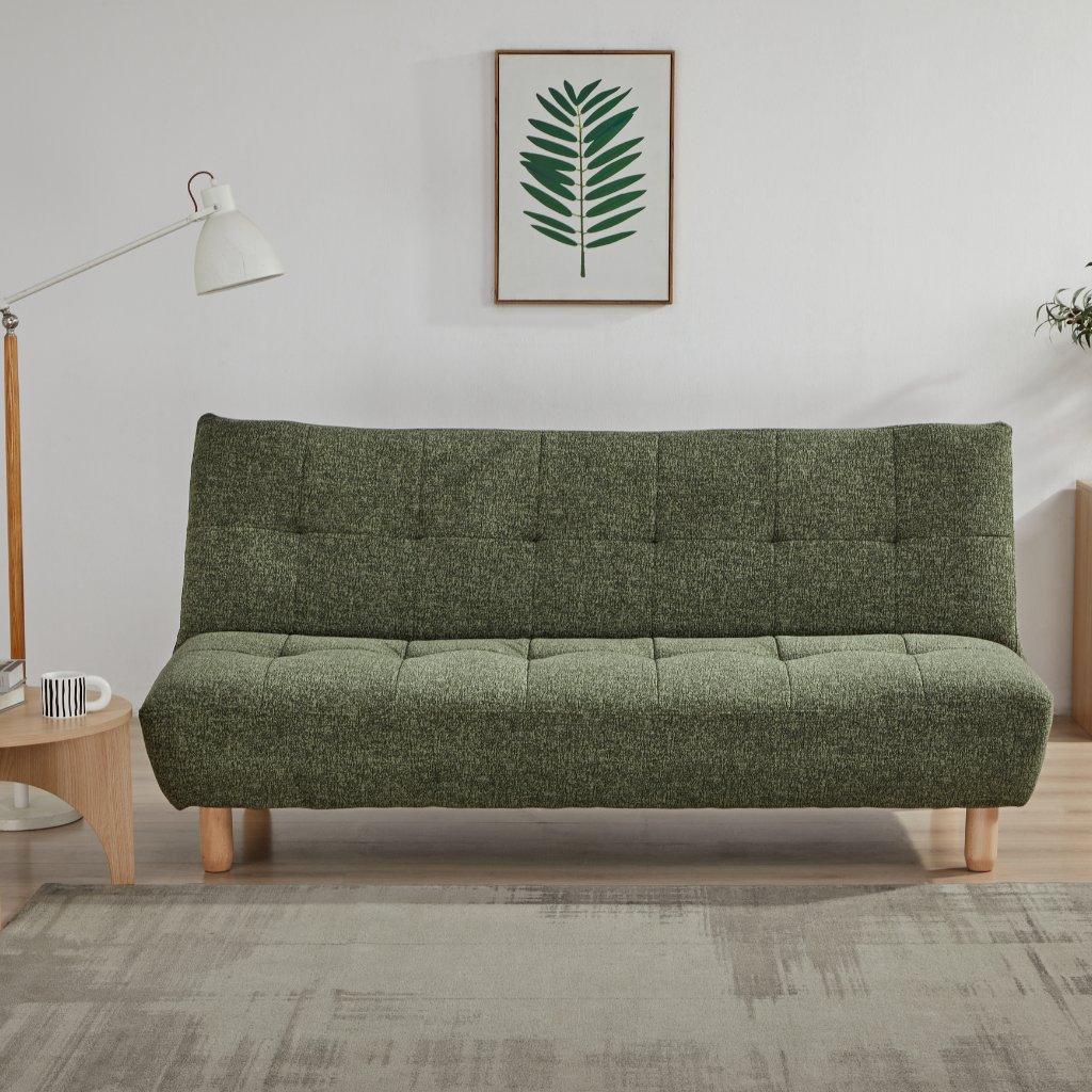 Laro Sofa Bed Green in guest bed configuration supported by wooden and steel legs