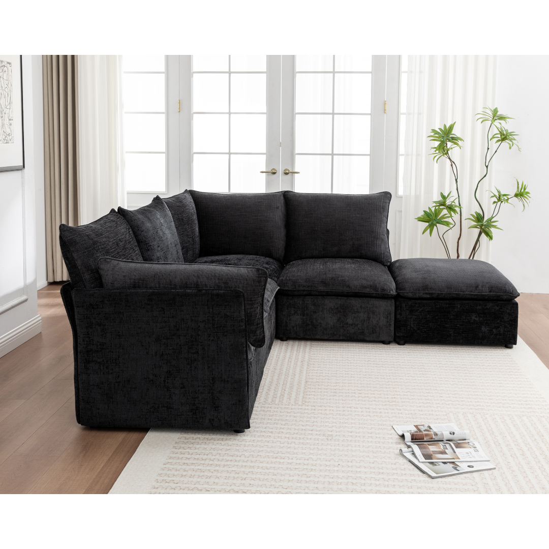 Lira Black Modular Sofa Set in a bright, modern living room with a neutral rug
