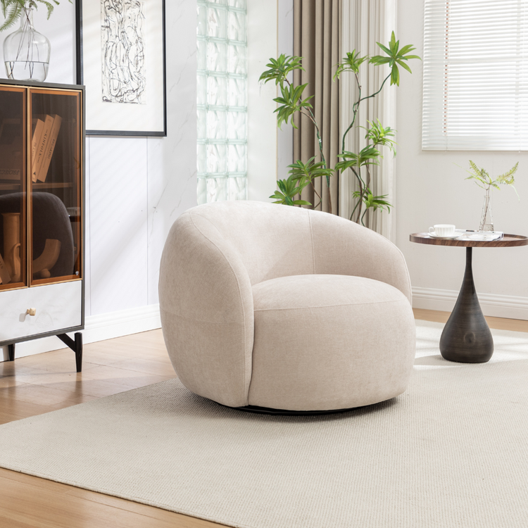 Beige Luno swivel chair with a sleek, rounded design in a living room setting.