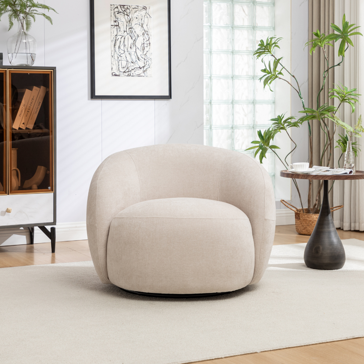 Luno Swivel Chair in a bright, modern living room with a bookshelf and plant.