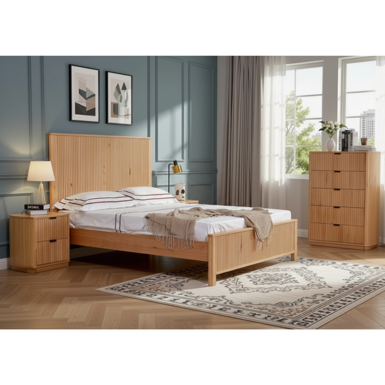 Nara bedroom suite natural messmate timber — queen bed frame with tall vertical ribbed panel headboard, matching bedside tables and tallboy in a Japandi-styled bedroom, NZ Furniture Warehouse Penrose Auckland