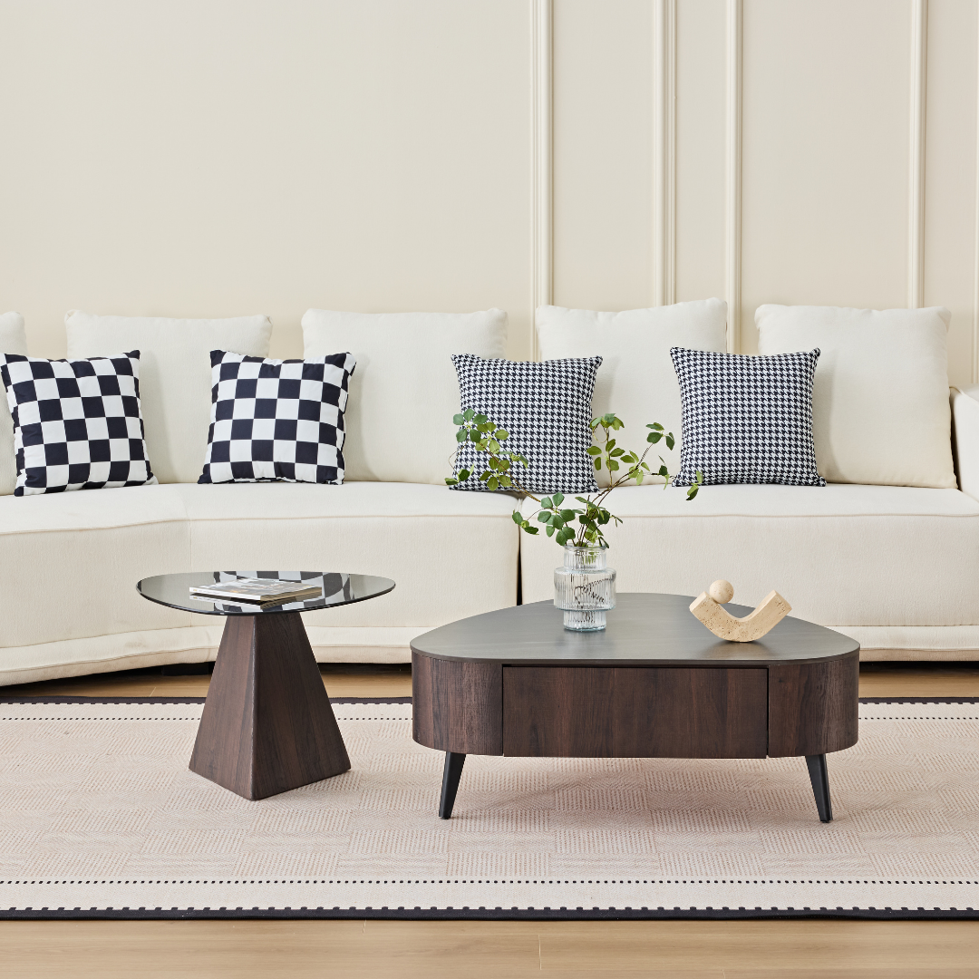 Oren nesting coffee table set with glass top and integrated storage drawer in a modern living room.