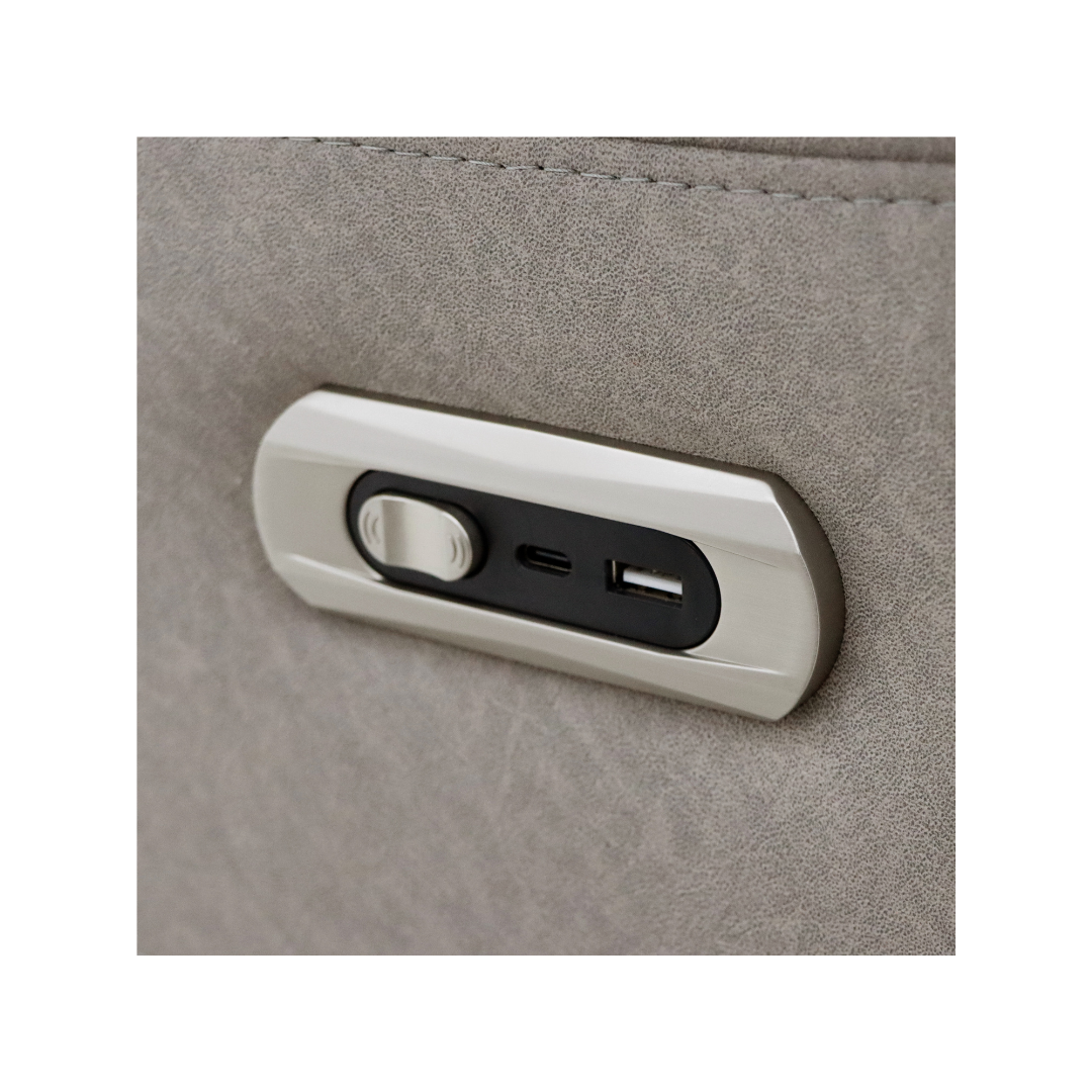 Close-up of the electric recliner control panel with USB and USB-C ports on the side of the Skara chair.