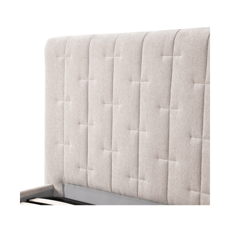 Close-up of the Soren Queen Gaslift Storage Bed's headboard showing the vertical channel stitching, cross-stitched detailing, and light oatmeal fabric texture